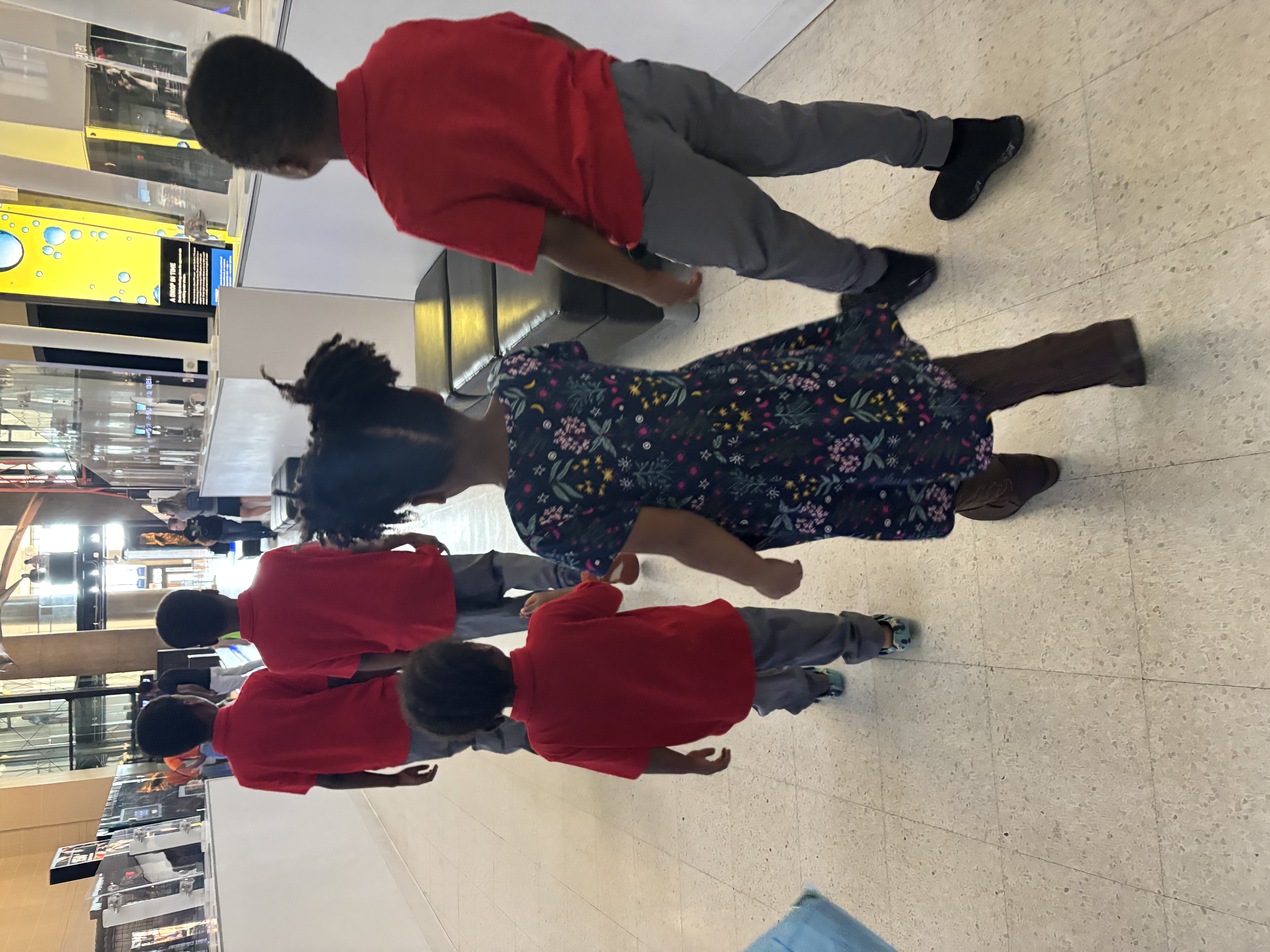homeschooled children in matching outfits at science museum